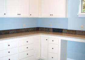 Upstairs laundry/hobby room, with slate floors, silestone counters and apron front sink.